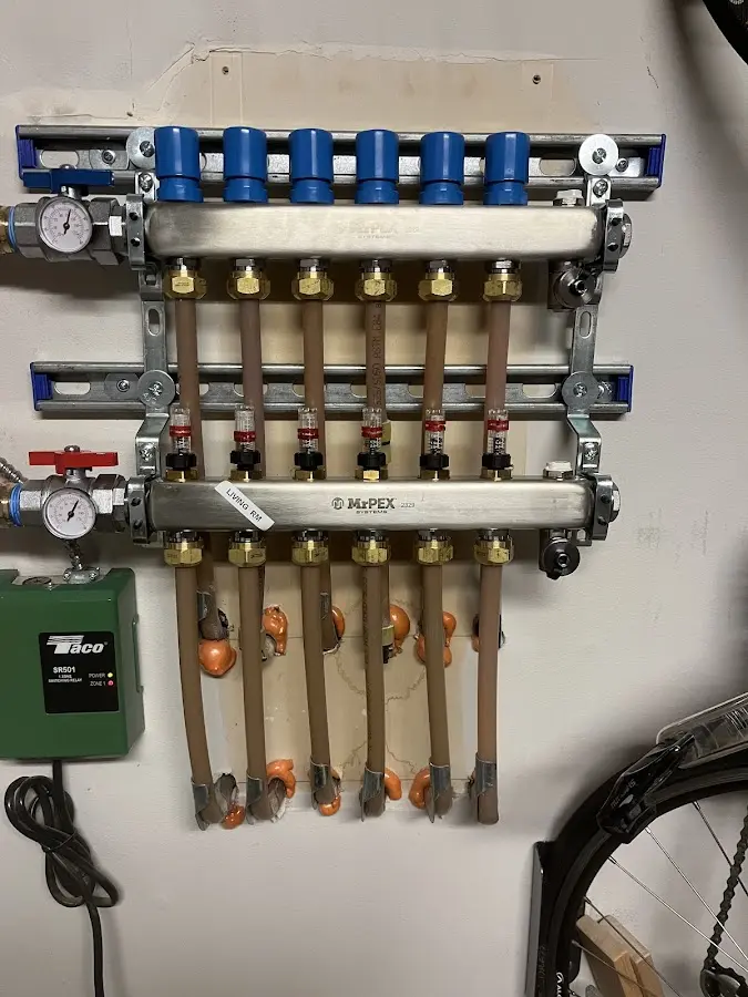 Plumber performing Water Heater Repair at a residential property in Southold